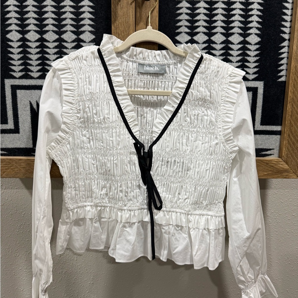 White Ruffled Blouse with Black Trim